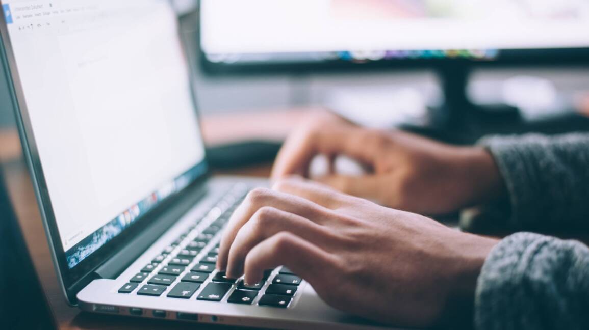 hands on a computer laptop